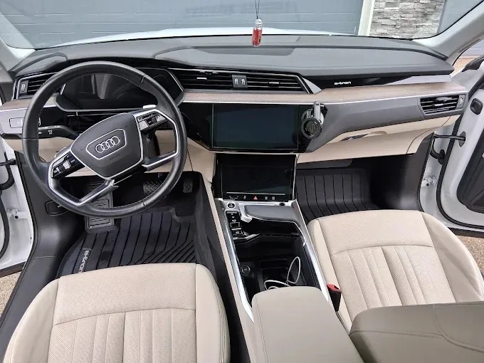 Audi e-tron cabin after an interior detail: dash, console and cream front seats