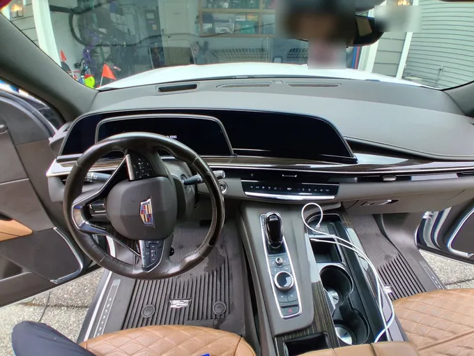 Cadillac Escalade dash, console and tan leather seats after an interior detail